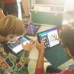 drei Kinder arbeiten mit Ipads