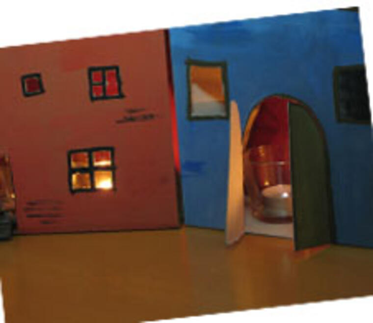 Häuser aus Pappe mit Teelicht innen